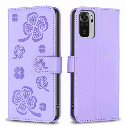 Lavender embossed four-leaf clover leather wallet phone case with magnetic flap.