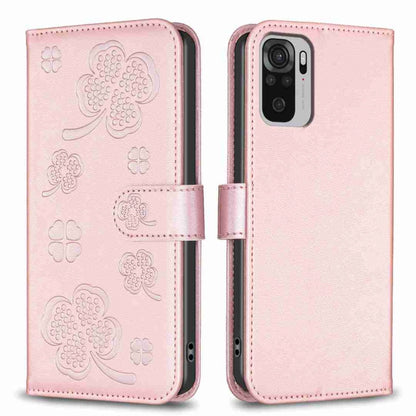 Light pink embossed four-leaf clover leather wallet phone case with magnetic flap.