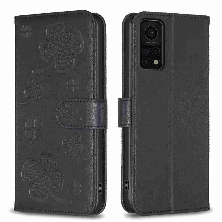 Black four-leaf embossed leather phone case with wallet flap and magnetic strap
