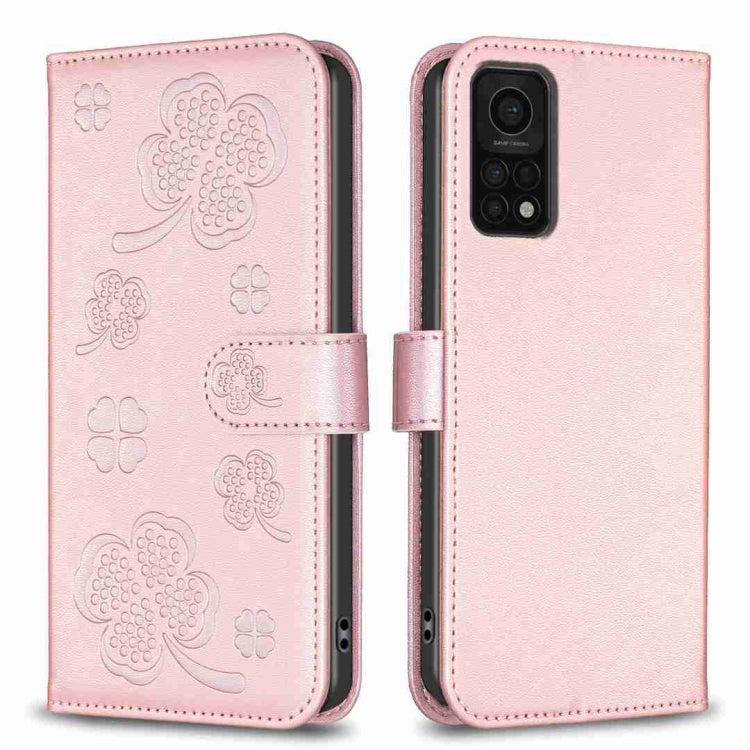 Rose-pink four-leaf embossed leather phone case with wallet flap and magnetic strap