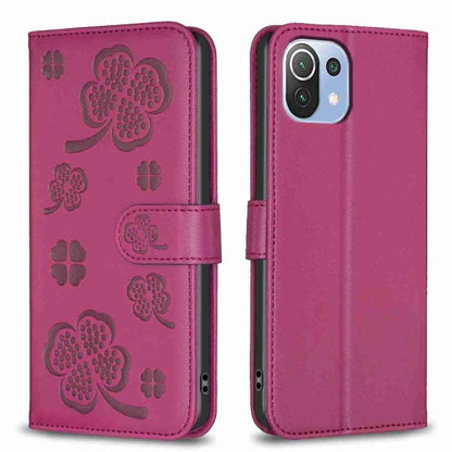 Four-leaf embossed leather phone case with folio strap, magenta plum color