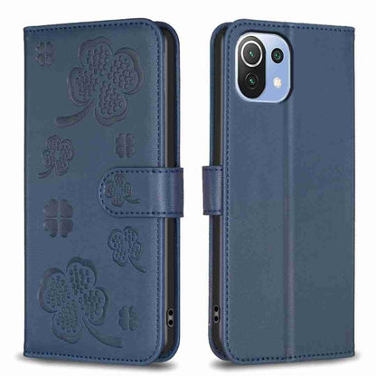 Four-leaf embossed leather phone case with folio strap, dark blue color