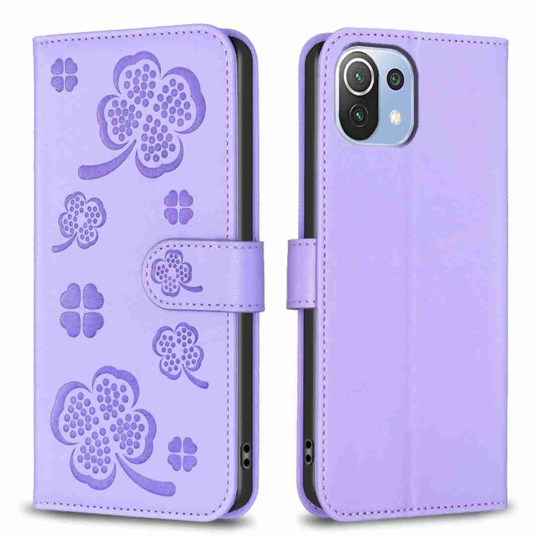 Lavender embossed four-leaf clover leather wallet phone case with magnetic flap.
