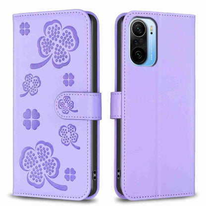 Lavender embossed leather phone case with four-leaf clover pattern and flip strap