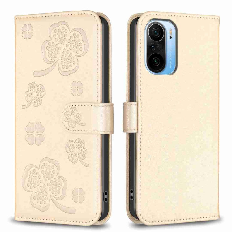 Light gold embossed leather phone case with four-leaf clover pattern and flip strap