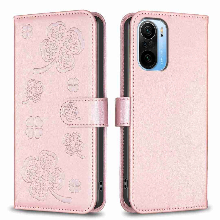Rose pink embossed leather phone case with four-leaf clover pattern and flip strap