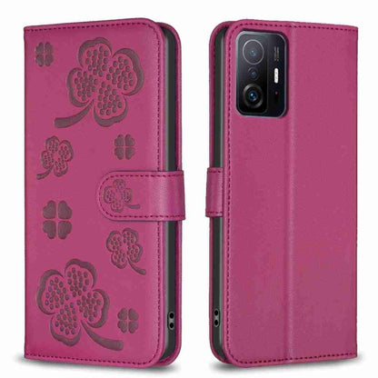 Rose-red embossed leather phone case with four-leaf clover pattern and folio flap