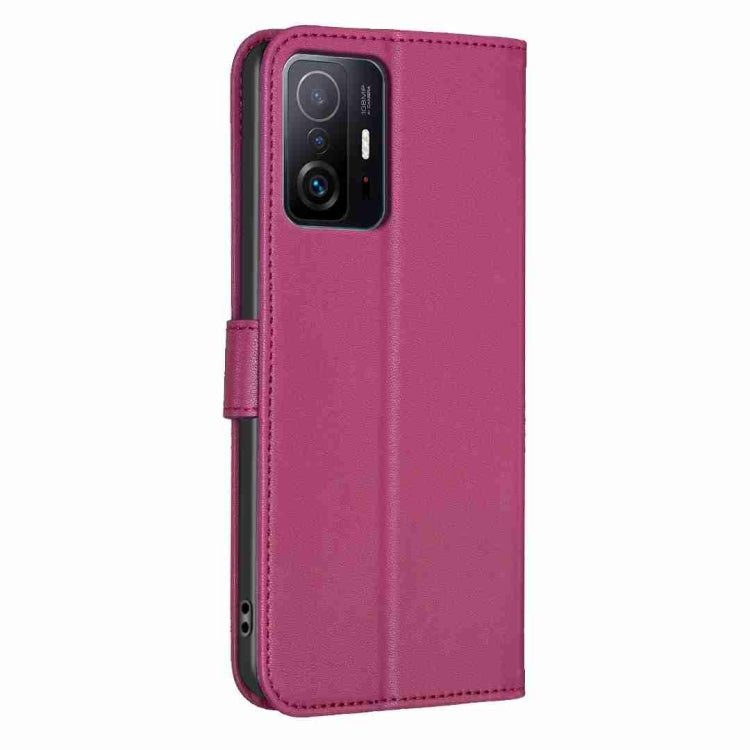 Rose-red embossed leather phone case with four-leaf clover design and camera cutout