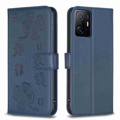 Blue embossed leather phone case with four-leaf clover pattern and folio flap