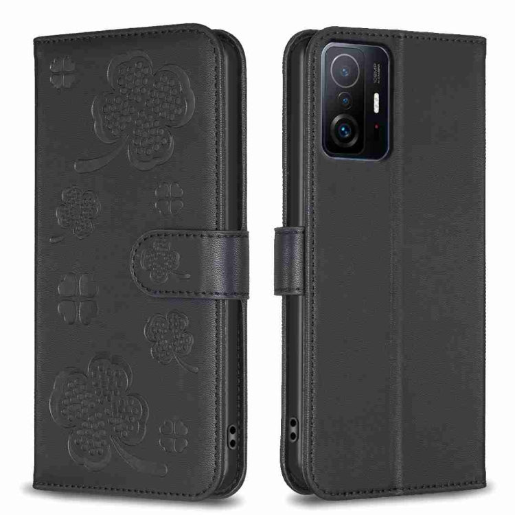 Black embossed leather phone case with four-leaf clover pattern and folio flap