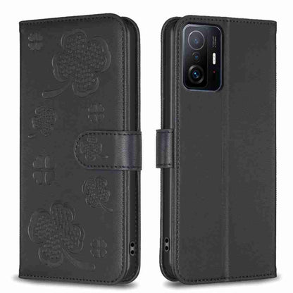 Black embossed leather phone case with four-leaf clover pattern and folio flap