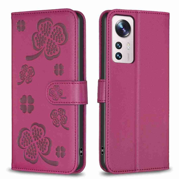 Four-leaf embossed leather phone case with folio strap, deep magenta