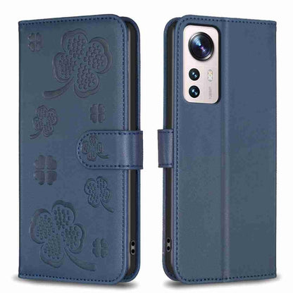 Four-leaf embossed leather phone case with folio strap, medium blue