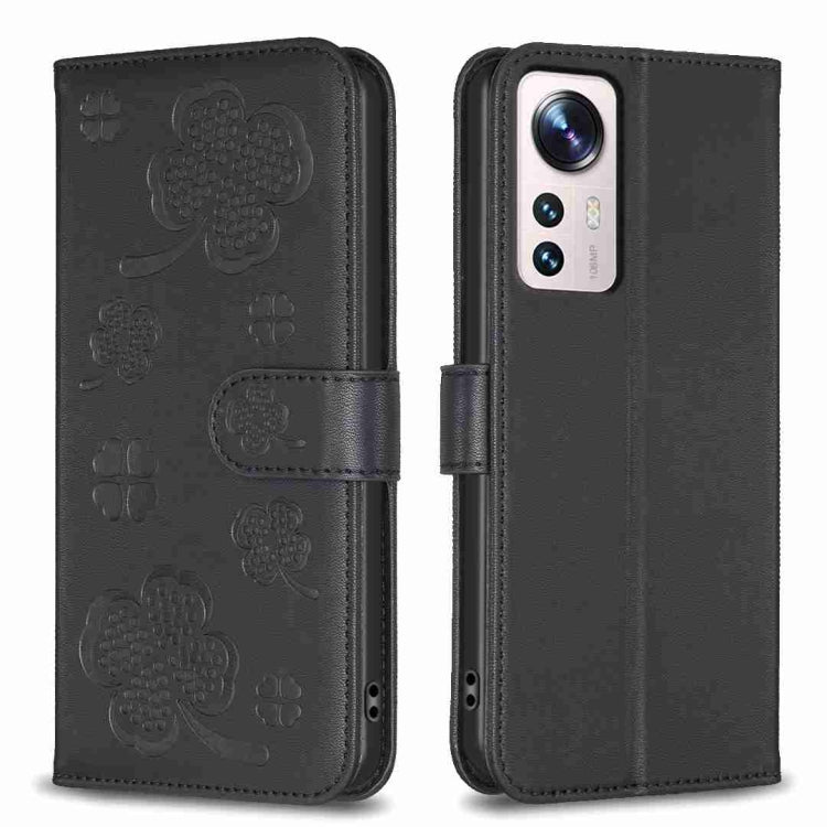 Four-leaf embossed leather phone case with folio strap, dark black