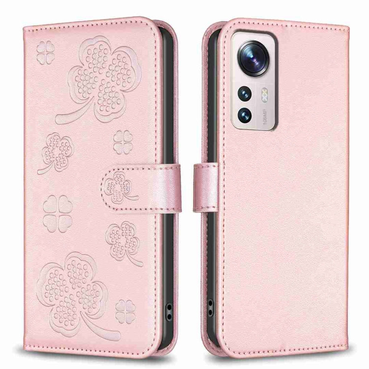 Four-leaf embossed leather phone case with folio strap, pale pink