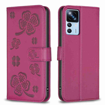 Magenta four-leaf embossed leather phone case with flip cover and clover cutouts