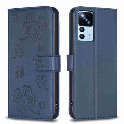 Blue four-leaf embossed leather phone case with flip cover and clover cutouts