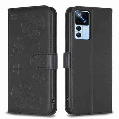 Four-leaf embossed leather phone case with folio strap, dark black