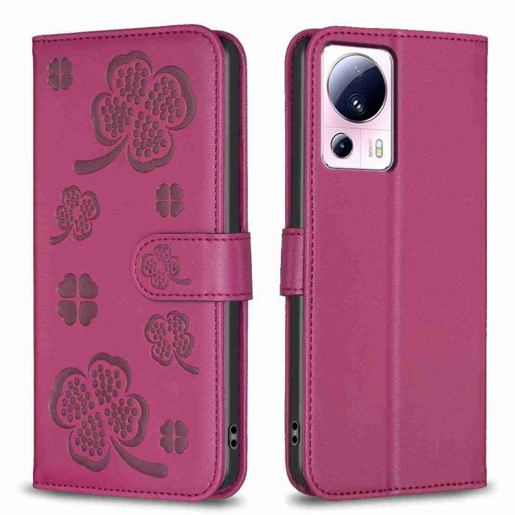 Rose red embossed leather-style phone case with four-leaf clover pattern and folio flap