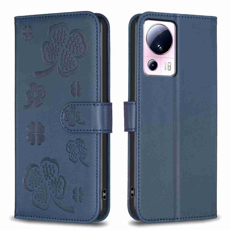 Blue embossed leather-style phone case with four-leaf clover pattern and folio flap