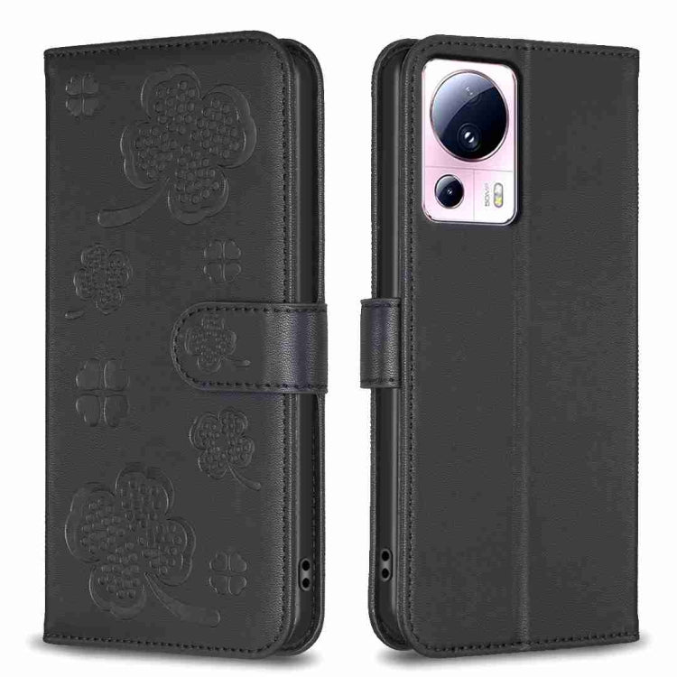 Black embossed leather-style phone case with four-leaf clover pattern and folio flap