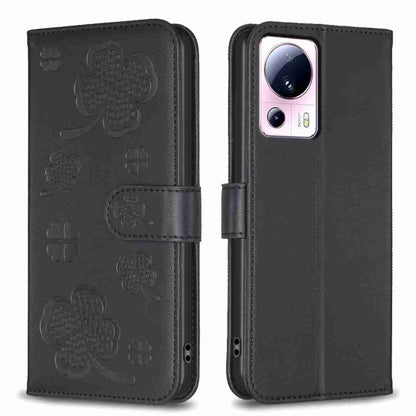 Black embossed leather-style phone case with four-leaf clover pattern and folio flap