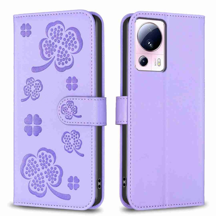 Lavender embossed leather-style phone case with four-leaf clover pattern and folio flap