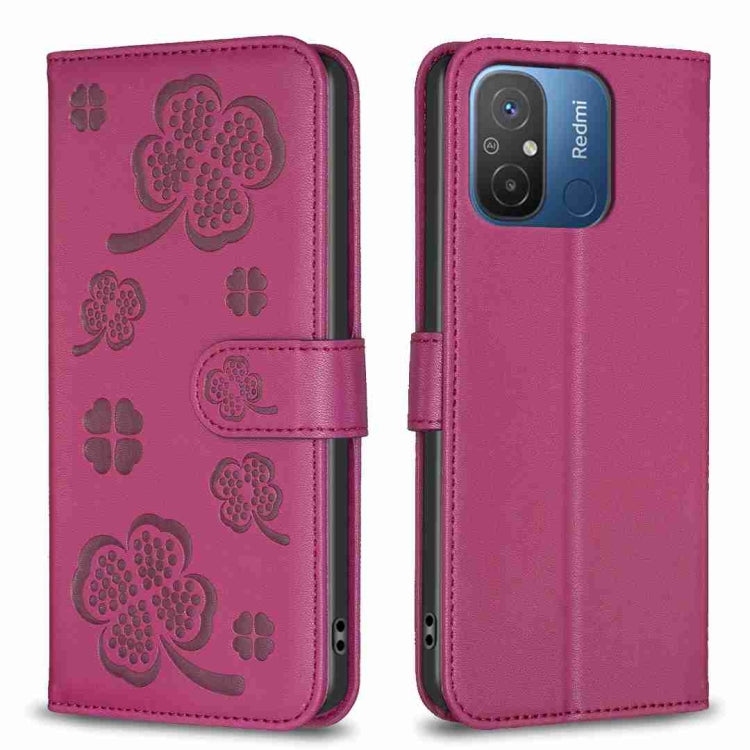 Magenta four-leaf embossed leather phone case with flip cover and side strap, camera cutout