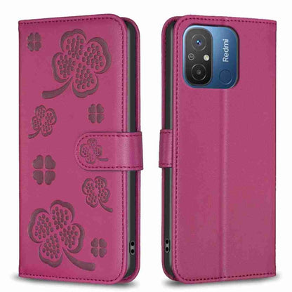 Magenta four-leaf embossed leather phone case with flip cover and side strap, camera cutout