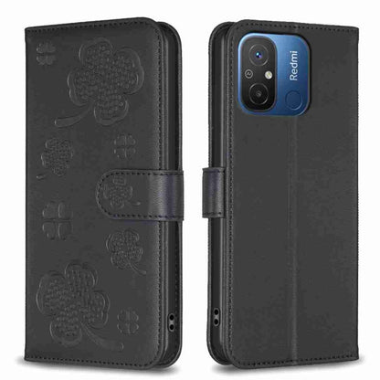 Black four-leaf embossed leather phone case with flip cover and side strap, front and back views
