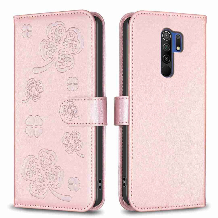 Pink embossed leather phone case with four-leaf clover pattern, flip cover and cutouts