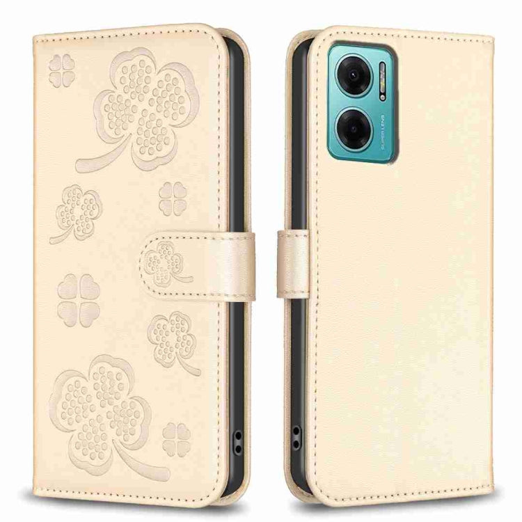 Embossed leather phone case with clover pattern and side flip strap, beige/gold