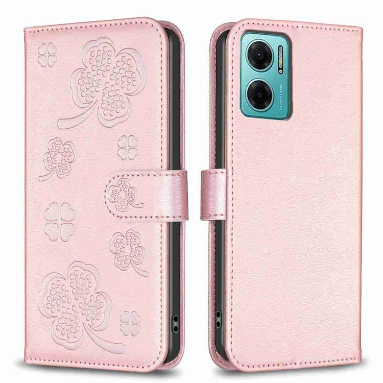 Embossed leather phone case with clover pattern and side flip strap, pale pink