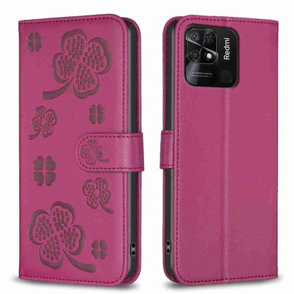 Four-leaf embossed leather phone case with folio flap, purple with clover pattern.