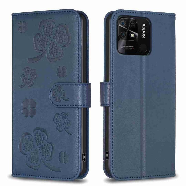 Four-leaf embossed leather phone case with folio flap, blue with clover pattern.