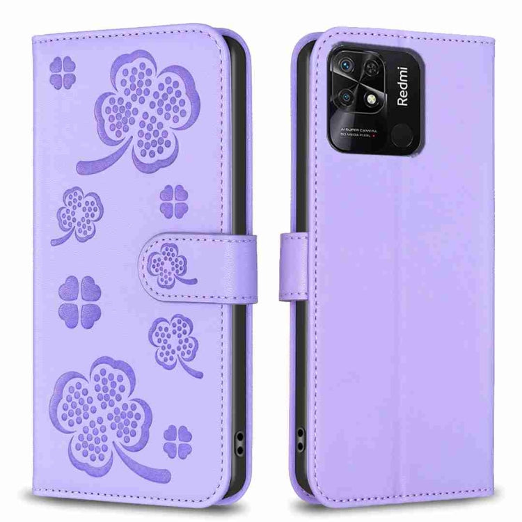 Four-leaf embossed leather phone case with folio flap, light lavender with clover pattern.