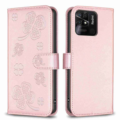 Four-leaf embossed leather phone case with folio flap, pink with clover pattern, close-up.