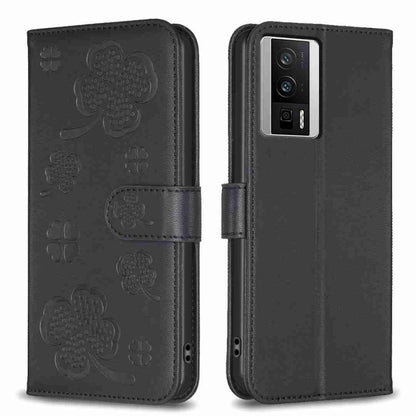 Black four-leaf embossed leather phone case with flip cover and clover pattern