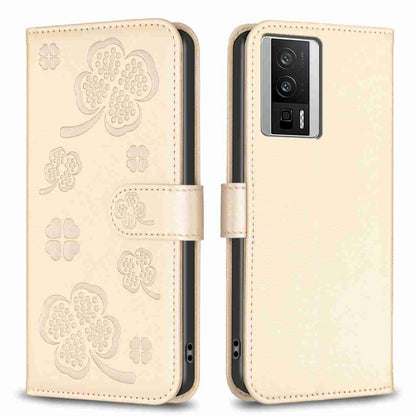 Beige four-leaf embossed leather phone case with flip cover and clover cutouts