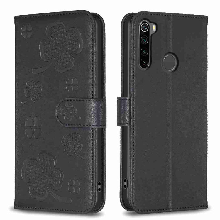 Dark embossed four-leaf clover leather phone case with fold-over strap and camera cutout