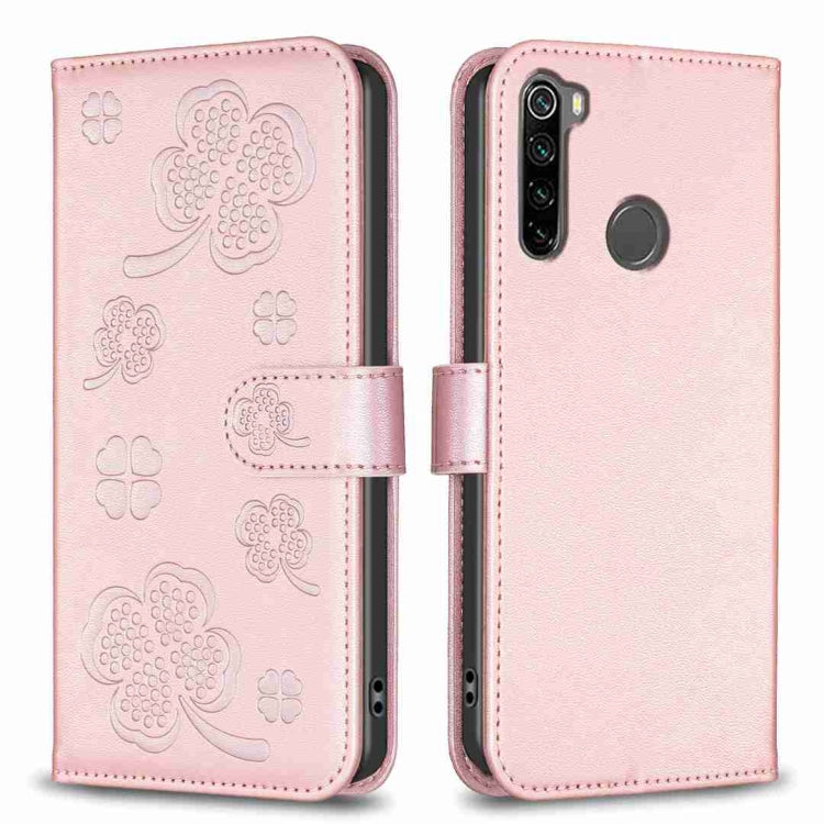 Light pink embossed four-leaf clover leather phone case with fold-over strap and cutouts