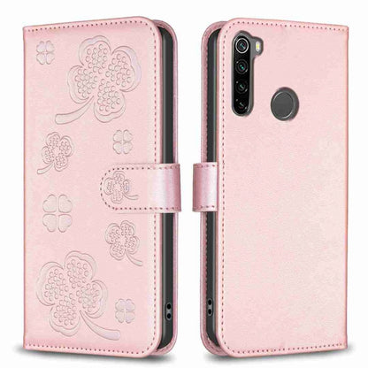 Light pink embossed four-leaf clover leather phone case with fold-over strap and cutouts