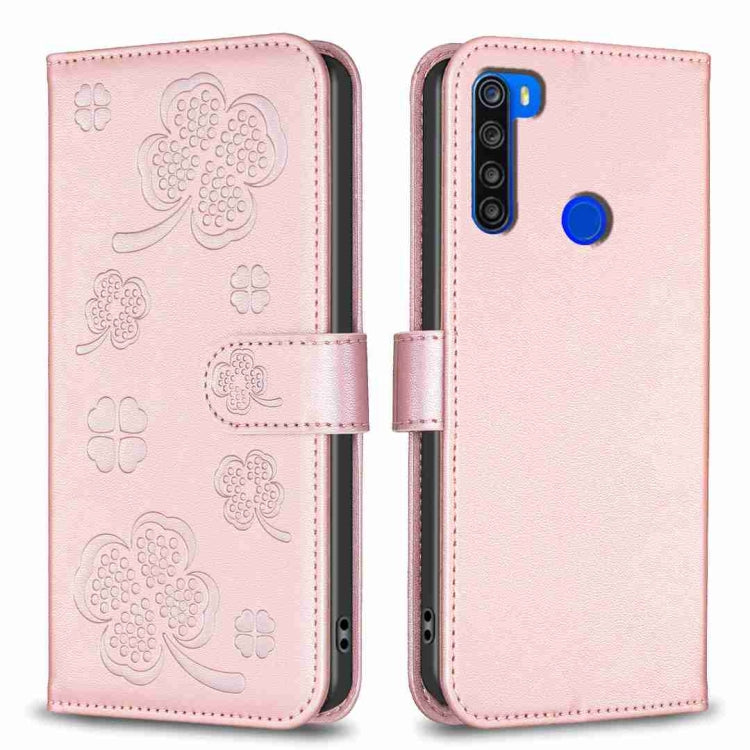 Four-leaf embossed leather phone case, pink folio with strap and blue camera accent