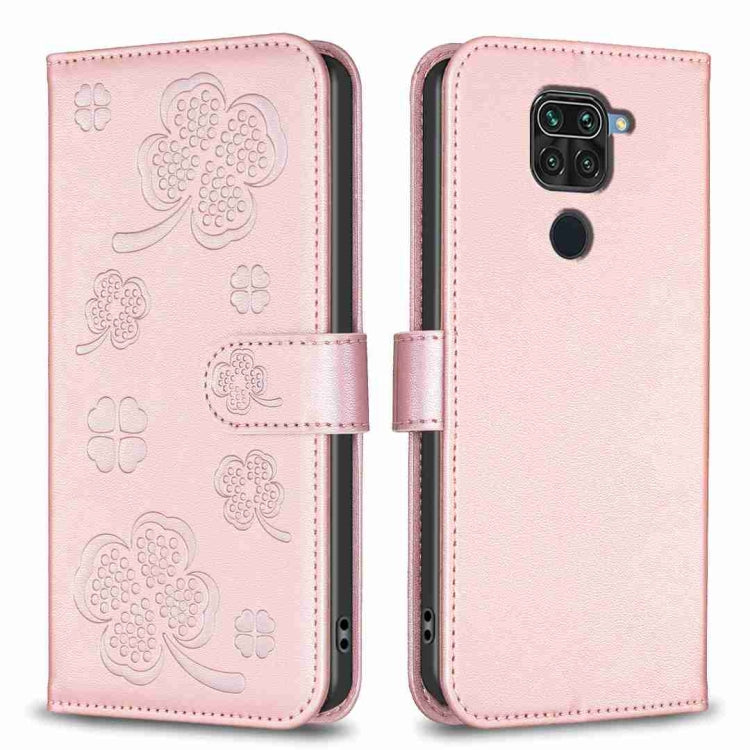 Pink embossed leather phone case with four-leaf clover pattern, flip cover and camera cutout