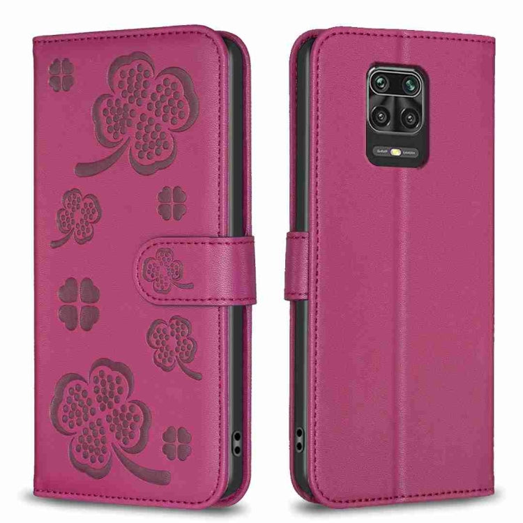 Magenta embossed leather phone case with four-leaf clover pattern, flip cover and camera cutout