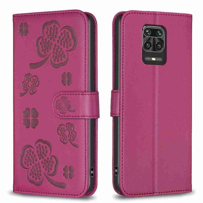 Magenta embossed leather phone case with four-leaf clover pattern, flip cover and camera cutout