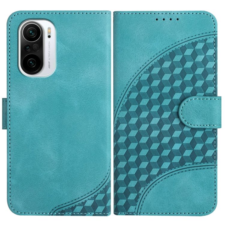 Light blue leather wallet phone case with embossed geometric pattern and side strap