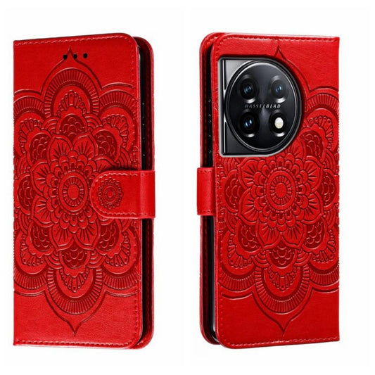 Red leather phone case with embossed sun mandala, folio flap and buckle strap.