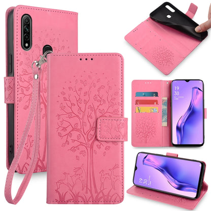 Pink embossed leather phone wallet case with tree and deer pattern, wrist strap, cutouts