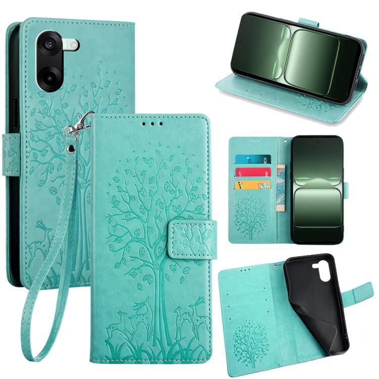 Embossed leather phone case in light teal with tree-deer pattern, flip cover, wrist strap
